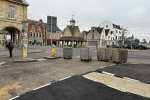 Wooden planters have returned to Witney High Street despite £15,000 of taxpayers’ money being spent building new crossing buildouts following concerns for pedestrian safety.